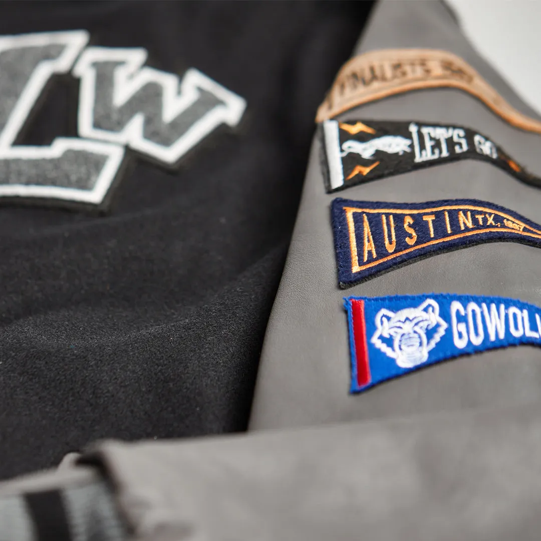 MIGHTY WOLVES VARSITY JACKET - BLACK