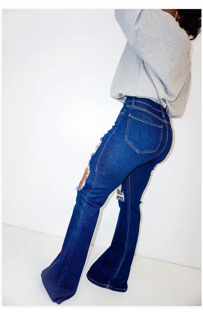 Ripped blue bell bottom jeans