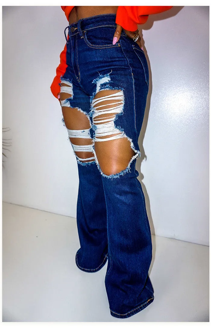 Ripped blue bell bottom jeans