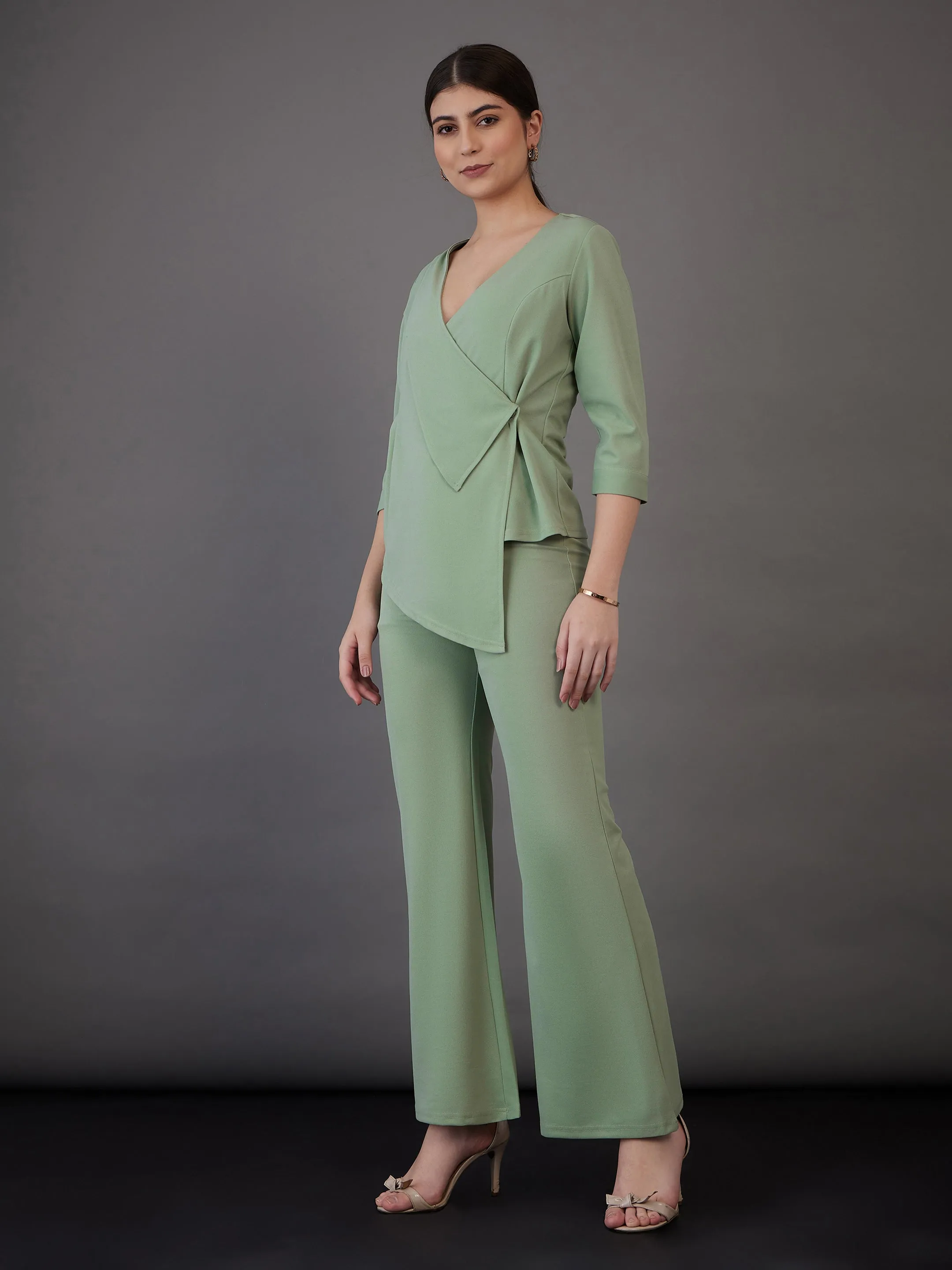 Women Green Wrap Asymmetric Top With Bell Bottom Pants